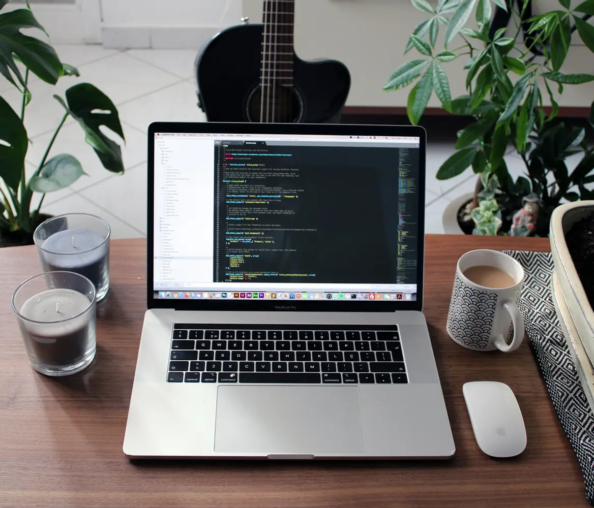 Laptop with code on a desk